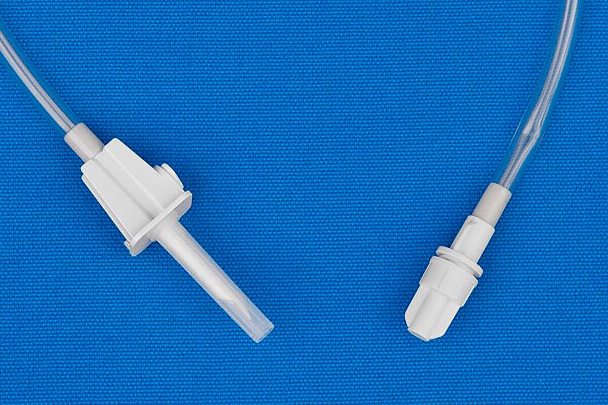 Close-up of the vented spike and female screw connector on a Metrix Secure gravity fill set